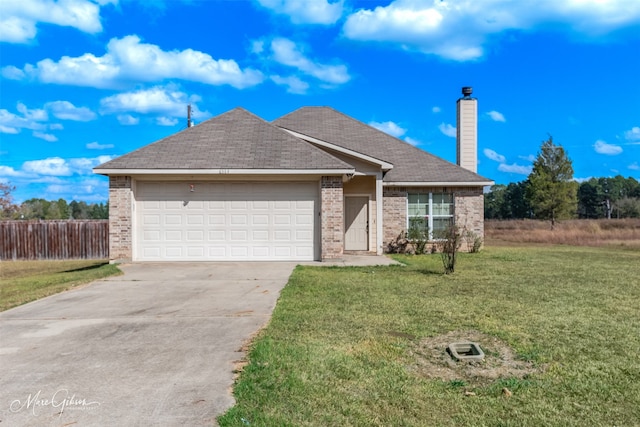 ranch-style home featuring a front yard and a garage