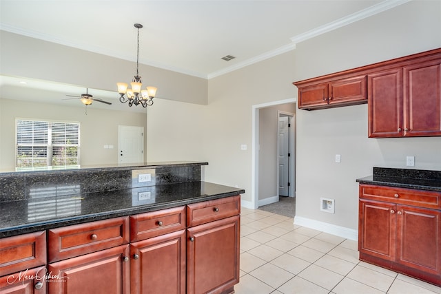 kitchen featuring dark stone countertops, ornamental molding, light tile patterned floors, and ceiling fan with notable chandelier