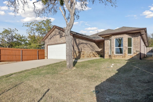 view of front of property with a front lawn and a garage