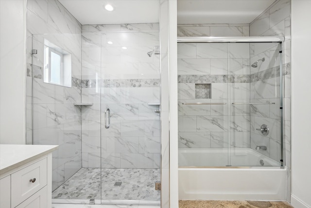 bathroom with vanity and enclosed tub / shower combo