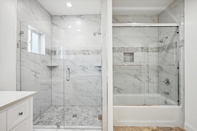 bathroom featuring vanity and tiled shower / bath