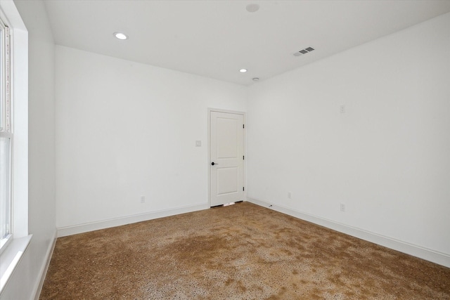 carpeted spare room featuring recessed lighting and baseboards