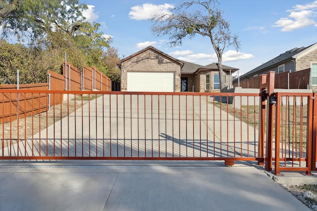 view of gate featuring a garage