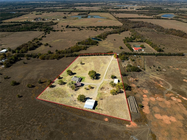 birds eye view of property with a rural view