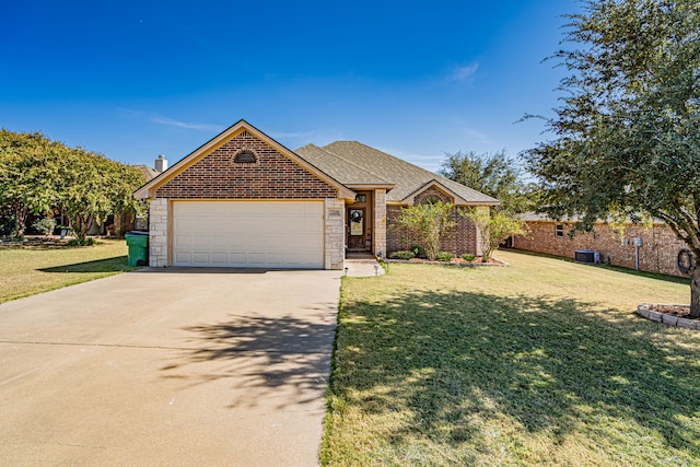 view of front of house featuring a garage and a front yard