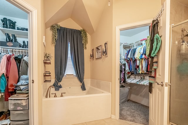 bathroom featuring independent shower and bath and tile patterned flooring