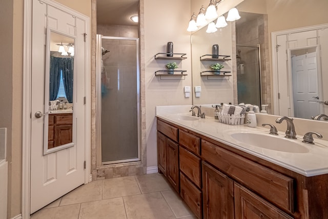 bathroom featuring vanity, a shower with shower door, and tile patterned flooring