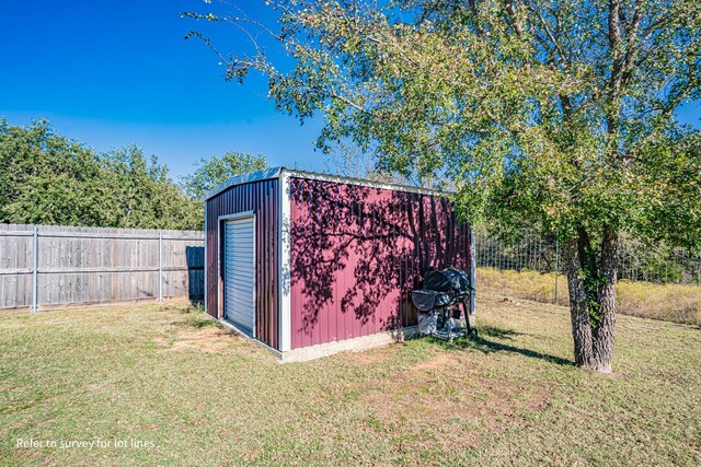 view of outbuilding featuring a lawn