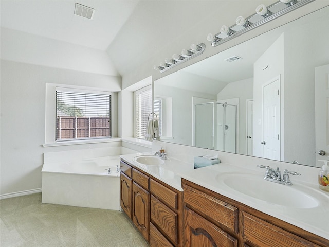 full bath with visible vents, a shower stall, lofted ceiling, and a sink