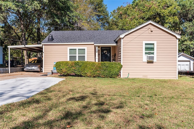 view of front facade featuring a carport and a front lawn