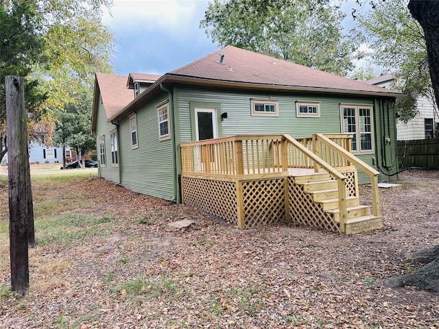 back of property featuring a deck