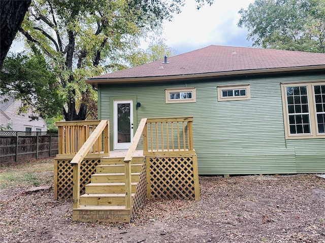 back of property featuring a deck