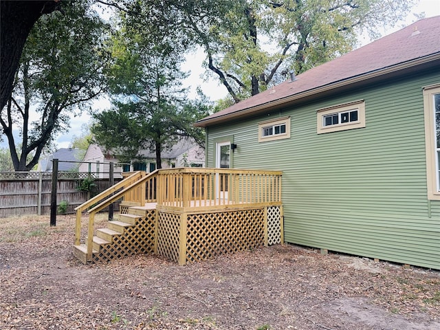 rear view of property with a wooden deck