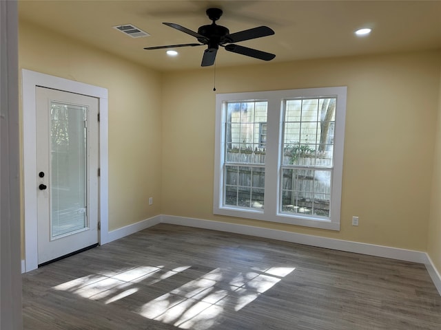 unfurnished room featuring hardwood / wood-style floors and ceiling fan