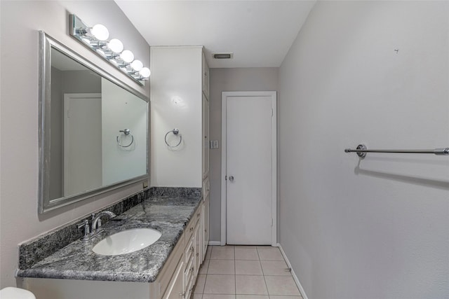 bathroom with vanity and tile patterned floors