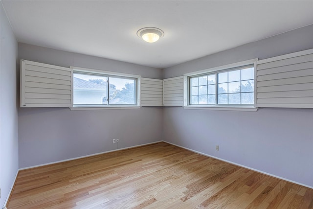 spare room with light hardwood / wood-style floors