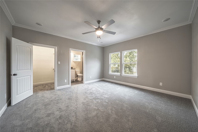 unfurnished bedroom with ornamental molding, ensuite bathroom, carpet, and ceiling fan