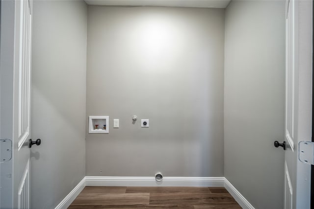 washroom featuring hookup for a gas dryer, electric dryer hookup, hardwood / wood-style flooring, and washer hookup