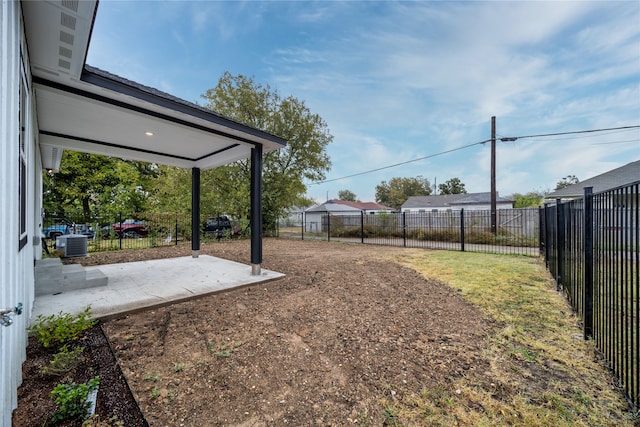 view of yard with a patio and central AC unit