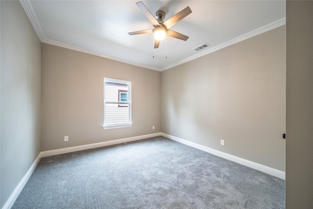 carpeted spare room featuring ceiling fan and crown molding