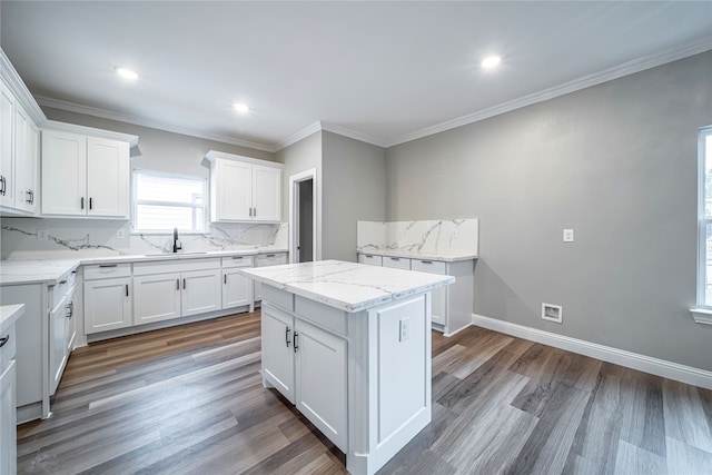 kitchen featuring a kitchen island, white cabinets, and dark hardwood / wood-style floors