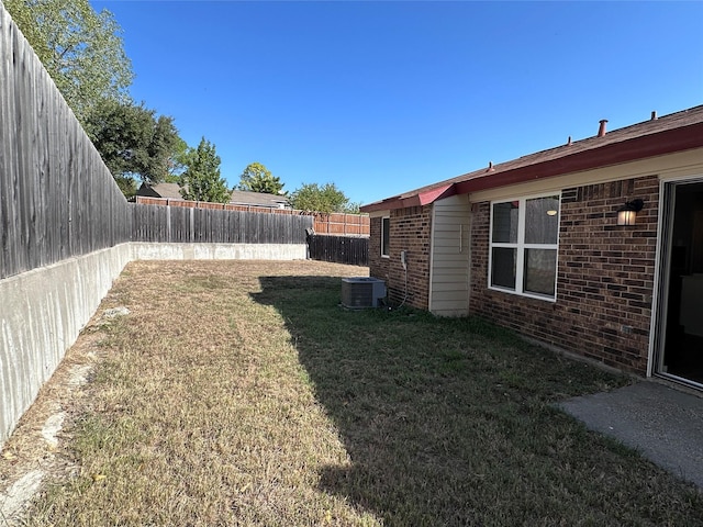 view of yard with central AC