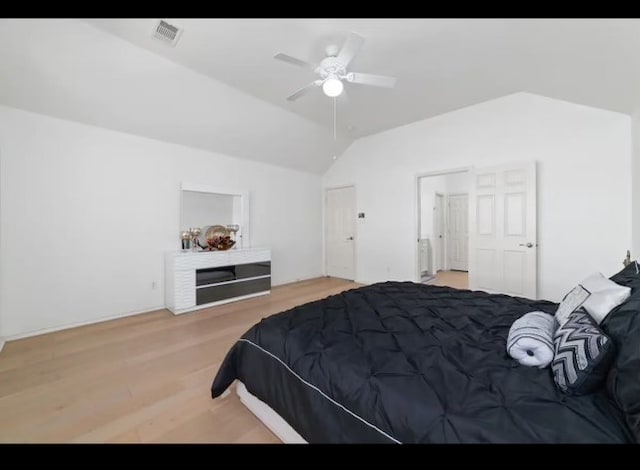 bedroom with light hardwood / wood-style floors, lofted ceiling, and ceiling fan