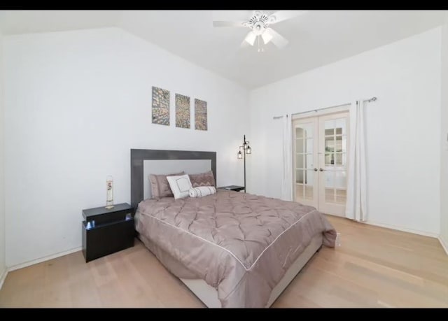 bedroom with ensuite bathroom, light wood-type flooring, french doors, ceiling fan, and lofted ceiling