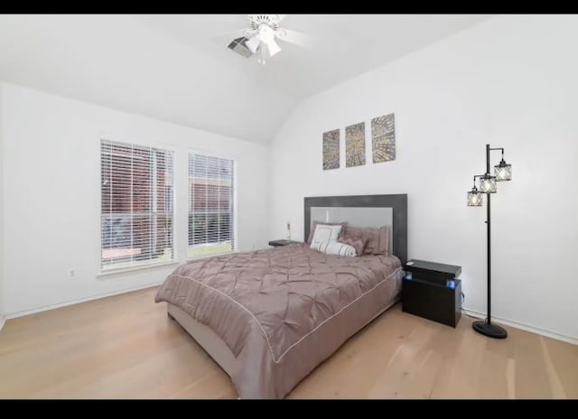 bedroom with lofted ceiling, light wood-type flooring, and ceiling fan