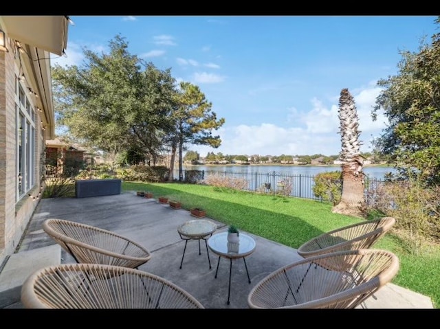 view of patio with a water view