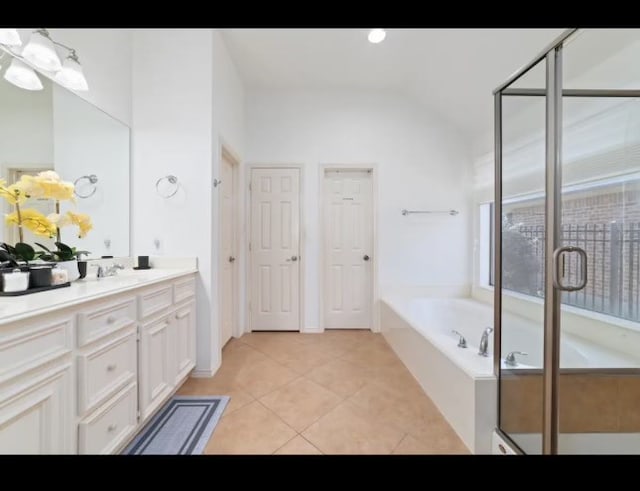 bathroom with vanity, tile patterned floors, and independent shower and bath