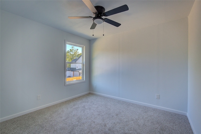 spare room with carpet flooring and ceiling fan