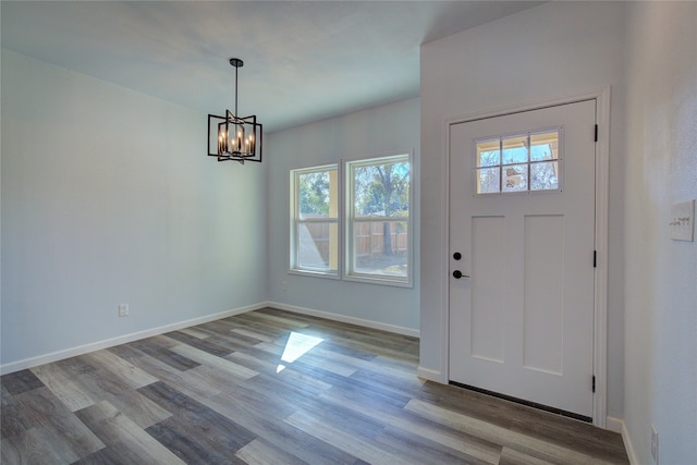 foyer featuring light hardwood / wood-style flooring and a chandelier