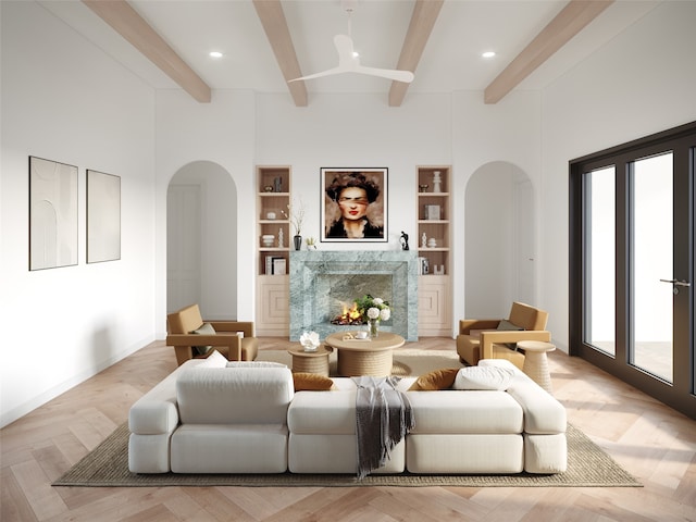 living room with built in shelves, a fireplace, beam ceiling, and light parquet floors