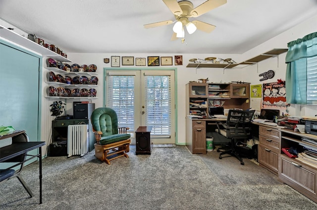 carpeted home office with french doors, ceiling fan, and radiator heating unit