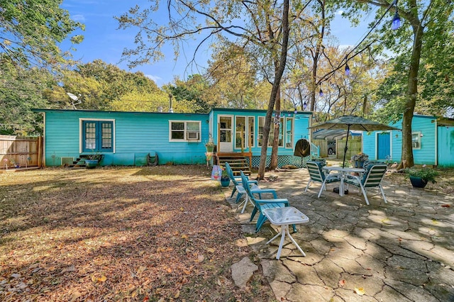 back of property featuring a patio