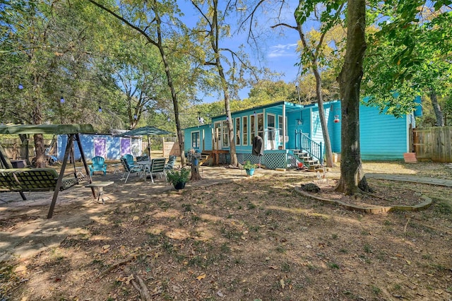 view of yard with a sunroom