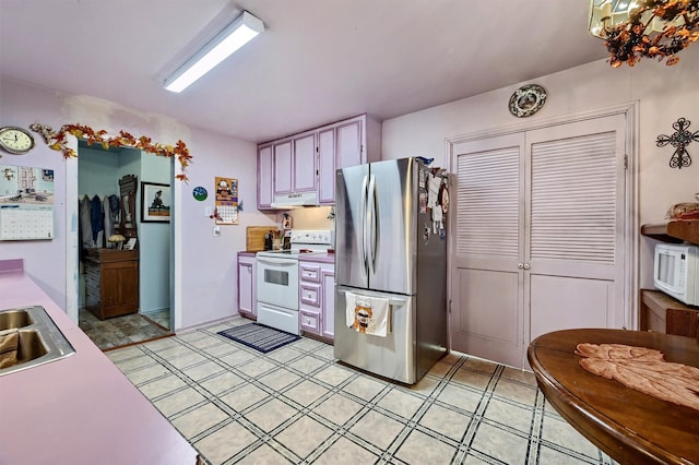 kitchen with sink and white appliances