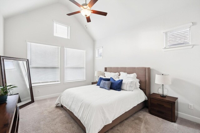 living room featuring a high ceiling, wood-type flooring, and ceiling fan with notable chandelier