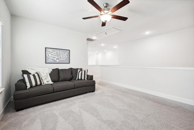 living room featuring light carpet and ceiling fan