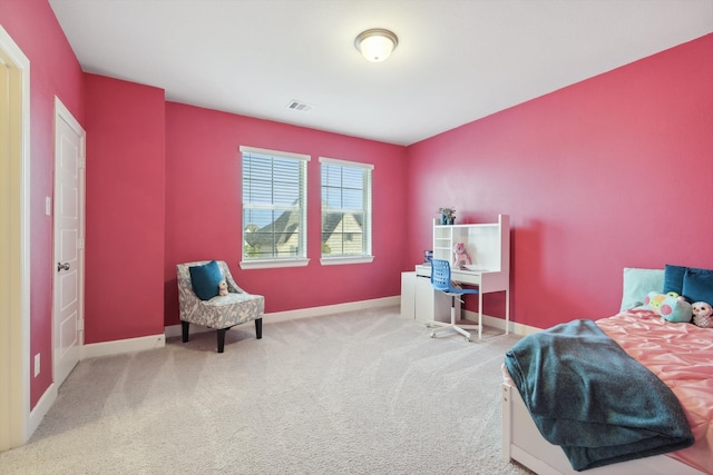 carpeted bedroom featuring visible vents and baseboards