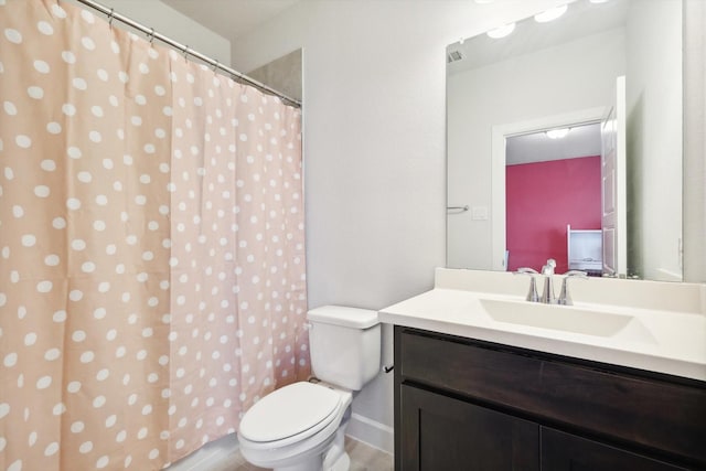 bathroom with toilet, visible vents, and vanity