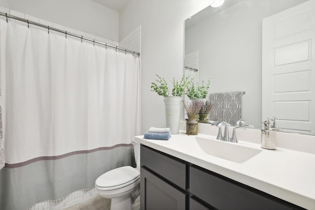 full bathroom featuring toilet and vanity