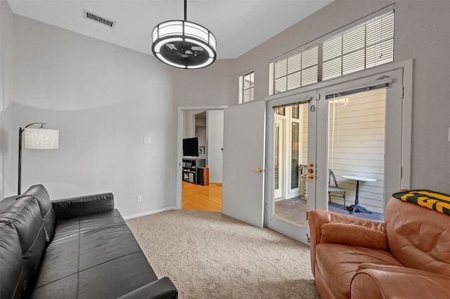 carpeted living room with french doors