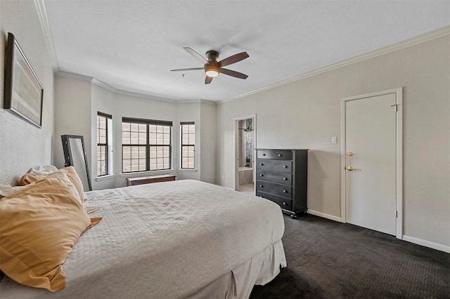 bedroom featuring crown molding, connected bathroom, dark carpet, and ceiling fan