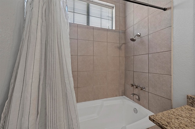 bathroom with shower / tub combo with curtain