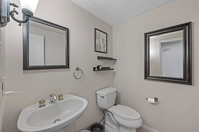 bathroom with sink and toilet