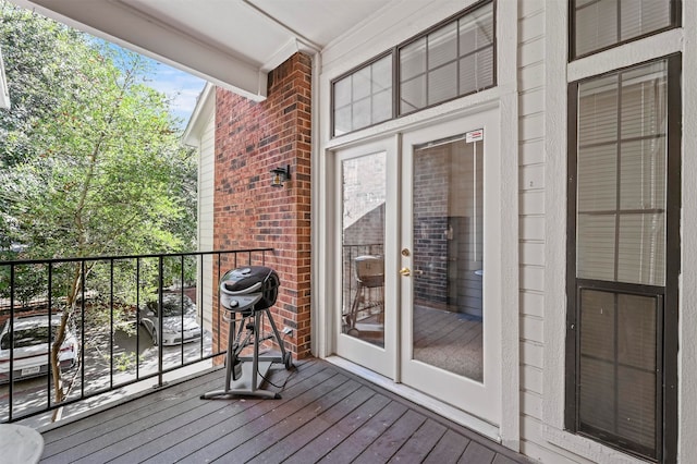 wooden terrace featuring grilling area