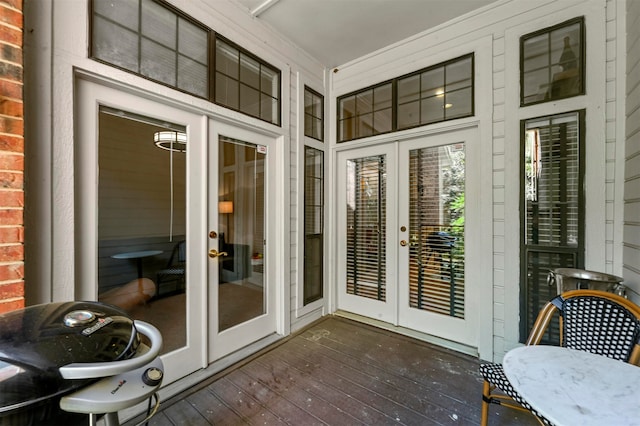 unfurnished sunroom with french doors