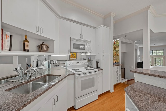 kitchen with white cabinets, light hardwood / wood-style floors, crown molding, sink, and white appliances